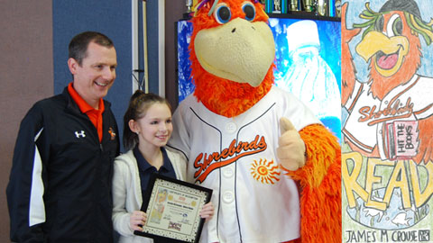 Kassidy McConaghy (middle) is the winner of the 2013 Hit the Books Bookmark Contest