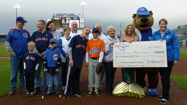 Christie Fleming (far right) from Chicken of the Sea presents the check for $10,000 to representatives from the Kiwanis Miracle League.