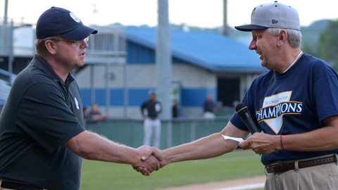 Jason Solomonson of "Remember the Miners" (left) accepts for the organization a donation check for $1372.00 from P-Rays General Manager Jim Holland. (Greg Barnett Photography)