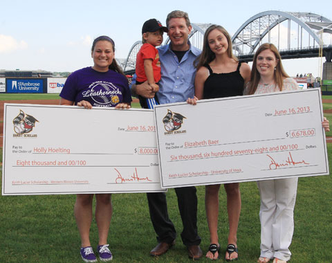 Holly Hoelting and Elizabeth Baer received their checks from Dave Heller and Jennifer Lucier Sunday afternoon. (Sean Flynn Photography)
