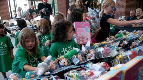 Kids from Boys and Girls Club of Truckee Meadows Early Learning Program select toys during today's press conference at Aces Ballpark. (David Calvert / Reno Aces)