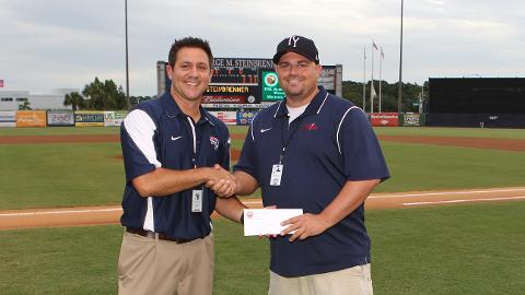 Asst. GM Matt Gess presented Michael with the FSL Scholarship. (Mark LoMoglio/Yankees)