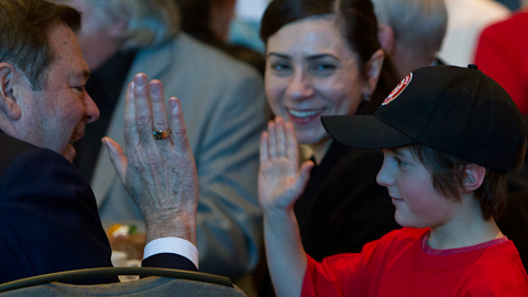 Scotiabank's David Poole gives a high-five to a future baseball star. (Paul Yates)