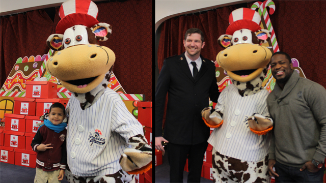 Scooter poses with local children, Salvation Army's Lt. Stephen Mayes & Giants LB Jameel McClain at local toy drive